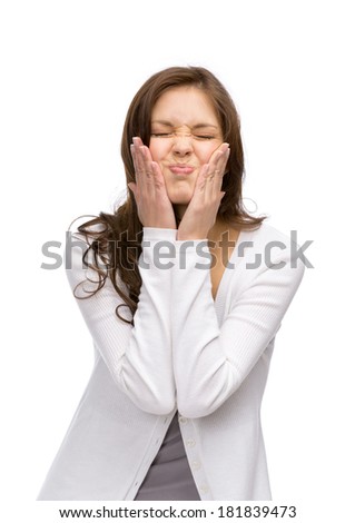Half-length portrait of funny woman with closed eyes touching her face, isolated on white