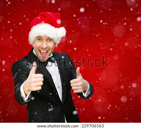 Half-length portrait of businessman wearing Santa Claus cap who thumbs up. Concept of holidays and Christmas