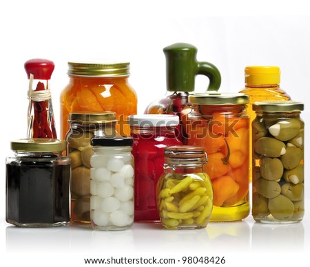 Glass Jars Of Preserved Fruits And Vegetables
