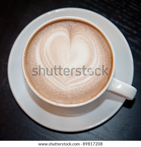 Mug of cafe mohca  with a heart shape sitting on a table at Caffe Crema in Calgary ストックフォト © 