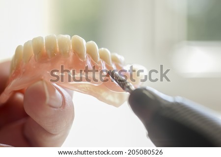 Dental technician working in dental laboratory