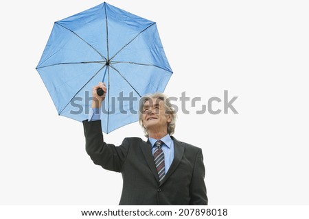 Germany, Hamburg, Businessman with umbrella
