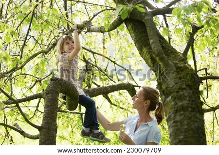 Similar – Image, Stock Photo Climbing a tree Parenting