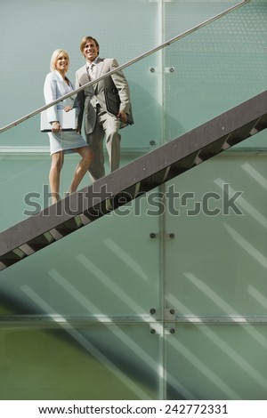 Germany, business people standing on stairs