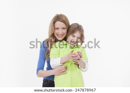 Mother and son with easter egg, smiling, portrait