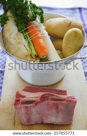 Ingredients to cook beef stock carrot, potatoes and meat