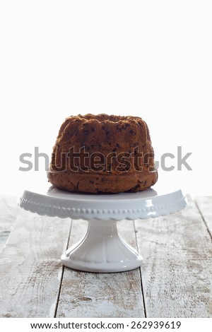 Chocolate flakes cake on cake stand