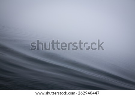 Calm sea surface with waves