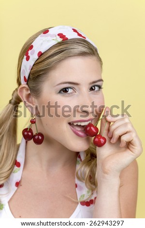 Young woman with cherries