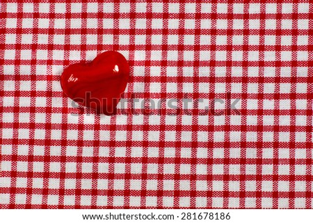 Heart on red white checked cloth