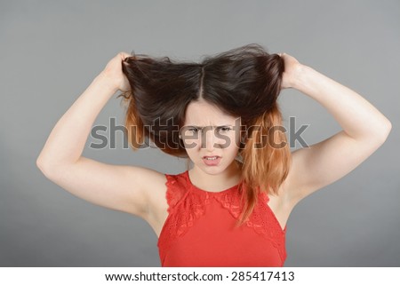 Young woman having a bad hair day