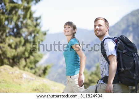 Germany,Upper Bavaria,Couple hiking,smiling
