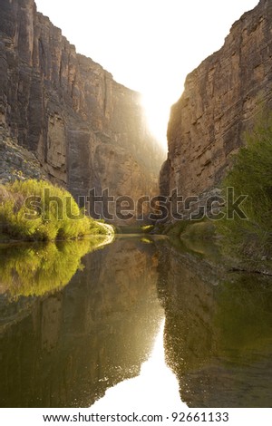 Sun setting behind Santa Elena Canyon on the Rio Grande river, border of United States and Mexico. Big Bend National Park, Texas, United States.