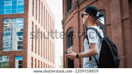 Similar – Image, Stock Photo man walking around on the street visiting Bilbao city Spain