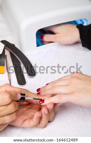 manicure and Hands with uv lamp for nails