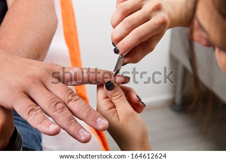 Care of man nails and manicure in beauty center
