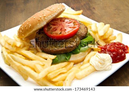 Beef Burger and french fried with cheese and vegetable
