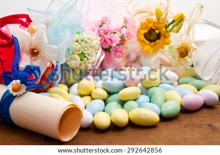 sugared almonds color blue, rose,  yellow  and white.