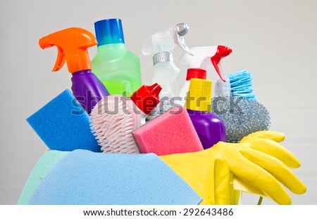 full box of cleaning supplies and gloves isolated on white
