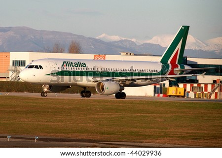 MILAN - JANUARY 2: An Alitalia airplane in Linate airport on January 2, 2010 in Milan, Italy. Alitalia recently announced it is to operate a codeshare agreement with Etihad Airways from Summer 2010