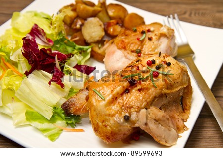 Roast chicken with salad and potatoes