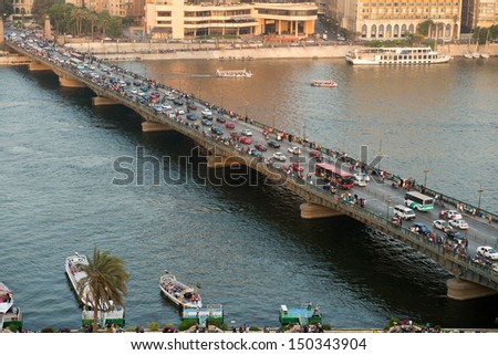 CAIRO - MAY 7: Sunset view of El-Tahrire bridge and Nile river in Cairo on May 7, 2013, Egypt. Cairo - the capital of Egypt and the largest city in the Arab world and Africa.