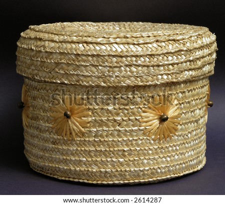 round straw wicker box  decorated with simple flower design