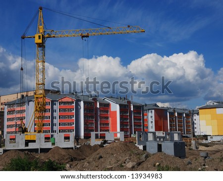 construction of a tenement-house, using lifting crane