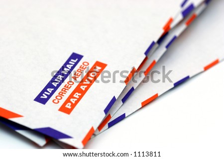Envelope with the words air mail in different languages with a shallow depth of field and in perspective