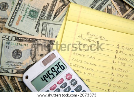 Lots of cash, twenty dollar bills, disperse over a table top with a calculator and a budget for planning.