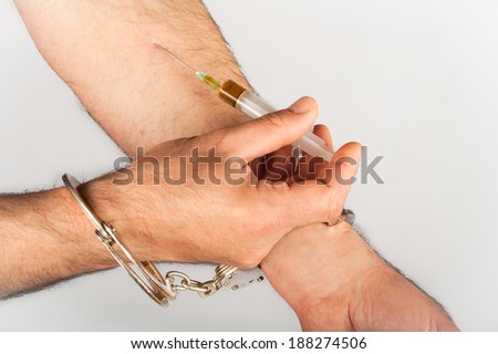 handcuffed hype applying injection shot in hand Isolated