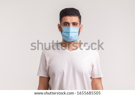 Protection against contagious disease, coronavirus, covid-19. Man wearing hygienic mask to prevent infection, airborne respiratory illness such as flu, 2019-nCoV. indoor isolated on white background