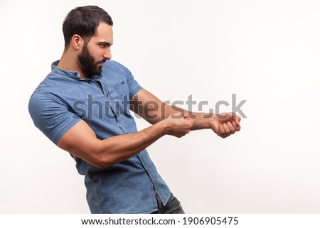 Profile portrait strong assertive man purposeful businessman with beard pulling invisible rope, showing his persistence and leadership qualities. Indoor studio shot isolated on white background Photo stock © 