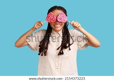 Similar – Image, Stock Photo Black woman eating candy