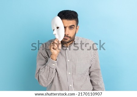 Similar – Image, Stock Photo Man covered his face with a breathing mask. Coronavirus, asthmatic and allergy concept. Artistic analog pinhole camera photography