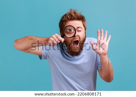 Similar – Image, Stock Photo Man with magnifying glass searches for the ideal employee