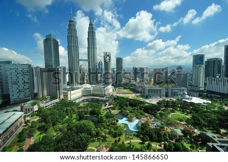 KUALA LUMPUR, MALAYSIA - AUGUST 24: Petronas Twin Towers at day on August 24, 2012 in Kuala Lumpur. Petronas Twin Towers  were the tallest buildings (452 m) in the world from 1998 to 2004.