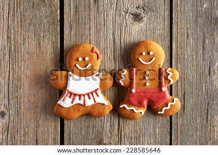Christmas homemade gingerbread couple cookies on wooden table