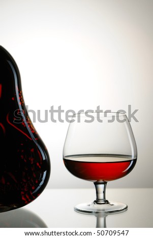 Cognac bottle and glass still life