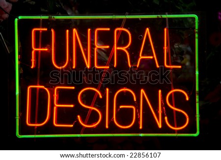 Florist\'s neon sign in the window of a Harlem, New York City store