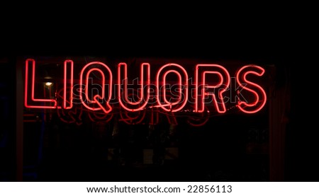 Neon liquor sign in the window of a Harlem, New York City liquor store