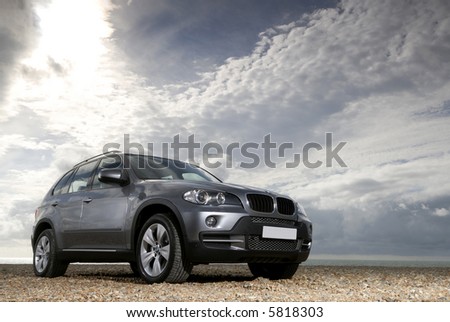 The new BMW X5 lit under a moody sky