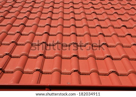 The roof is covered with red roofs of concrete tiles