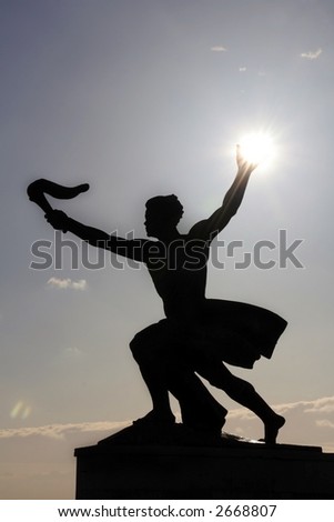 Young man with a sun in his hand and a torch in the other: part of the Liberation monument on the top of Gellert Hill in Budapest (lucky shot!)