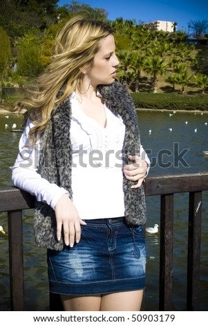 Beautiful woman in a duck pond
