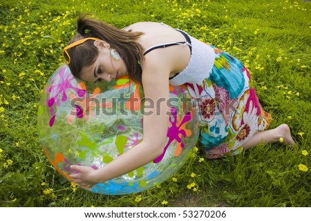 young hippie girl hugging her summer ball