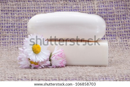 soap with flowers in sacking cloth with flowers isolated on white background