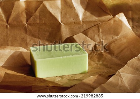 green homemade soap on craft paper