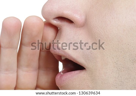 Man shouting loud with hands on the mouth