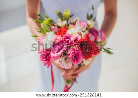 Beautiful wedding bouquet colourfull flowers n hands of the bride lovely day